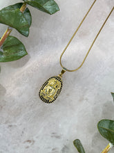 Load image into Gallery viewer, Meditating Buddha Black &amp; Gold Medallion Necklace